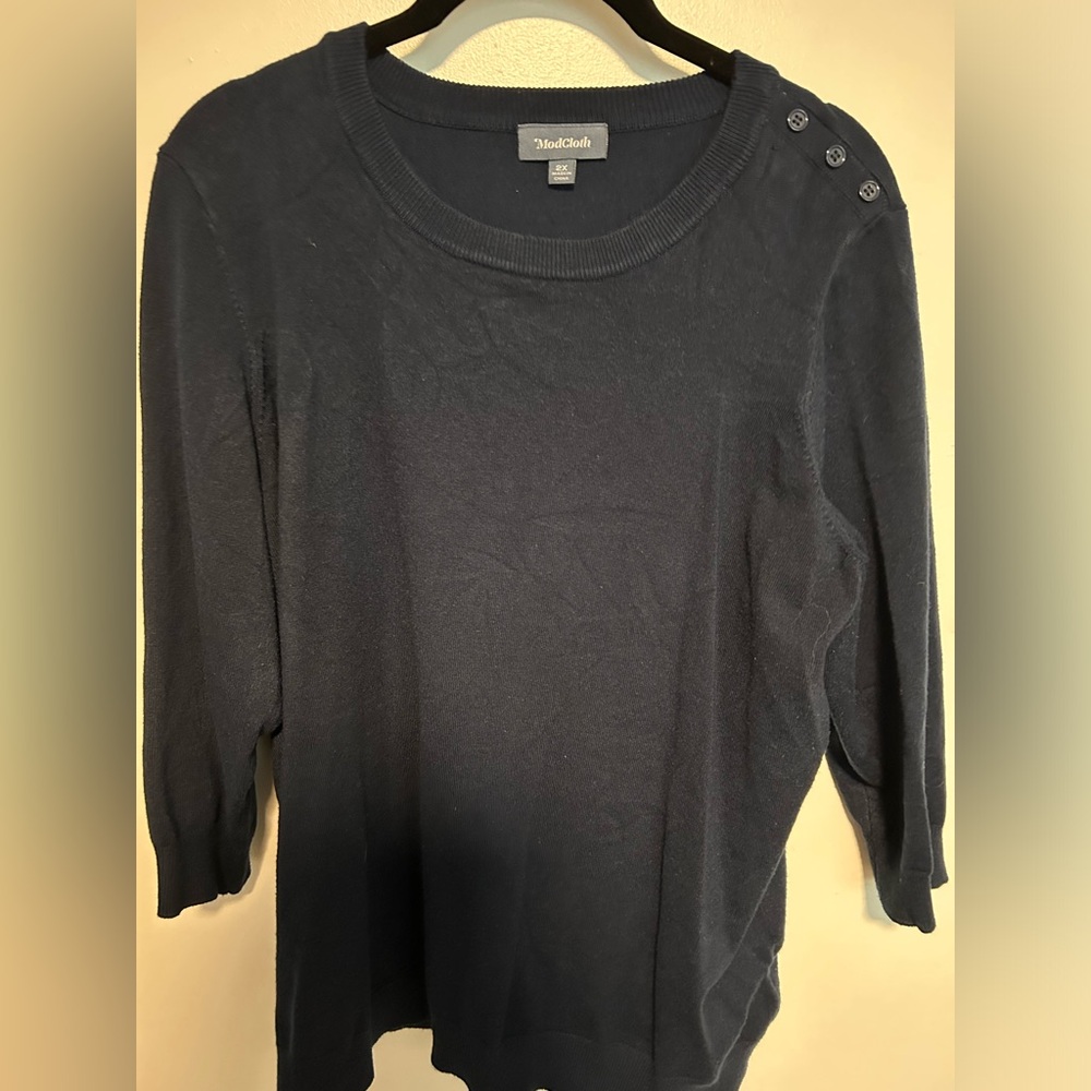 Classic sweater with button shoulder